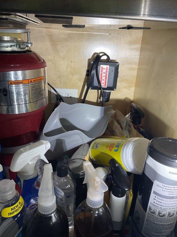 Completed comprehensive annual plumbing maintenance inspection of residential property with no reported issues. Performed visual assessment of exterior hose bib and connection integrity, confirming proper mounting and seal condition on exterior wall. Inspected under-sink plumbing access area, verifying supply lines, shut-off valves, and drain connections for leaks or deterioration, with all components found to be functioning within normal parameters.