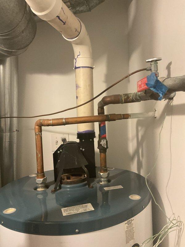 Conducted on-site assessment of existing Rheem 75-gallon, 75,000 BTU natural gas power vent water heater in condo unit for replacement estimate. Documented current installation configuration including copper supply lines, PVC venting system, temperature and pressure relief valve piping, shut-off valves, and power vent motor assembly. Photographed all plumbing connections, gas line routing, condensate drainage, and clearance dimensions to provide accurate quote for comparable Rheem model replacement with similar specifications and power vent configuration.