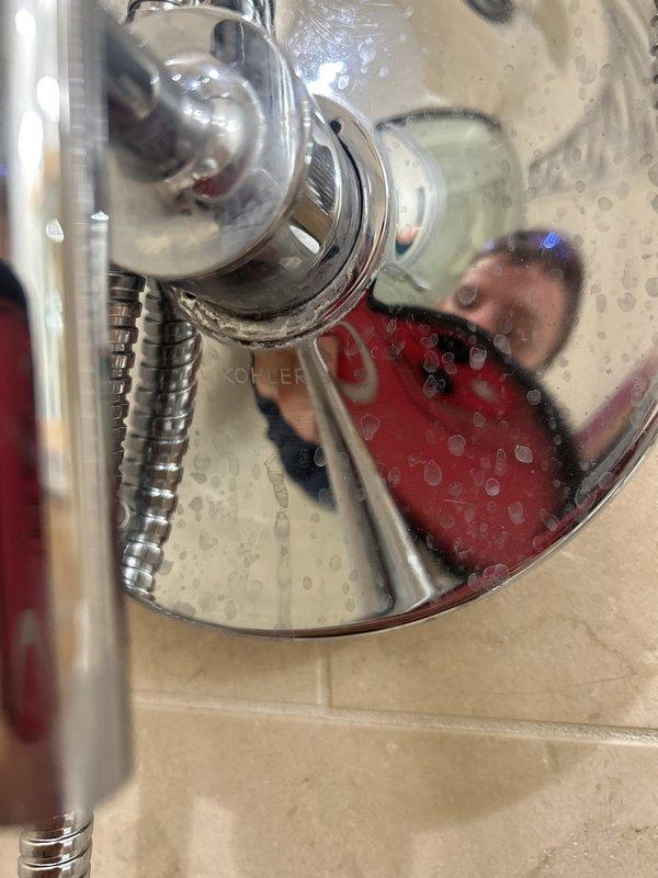 Responded to service call for a Kohler Purist valve trim experiencing continuous dripping from the showerhead at approximately 3 drips per minute when in the closed position. Customer had already eliminated the showerhead and hose as potential causes through replacement. Diagnosed the issue as a faulty valve cartridge within the wall-mounted mixing valve assembly. Accessed the valve by removing the Purist trim handle and escutcheon. Removed the existing cartridge and inspected the valve body for debris, mineral deposits, and seat damage. Installed a new OEM Kohler valve cartridge, ensuring proper alignment and seating. Reassembled the trim components and tested the valve operation through multiple open/close cycles. Verified complete water shutoff with no residual dripping from the showerhead. System restored to full functionality.