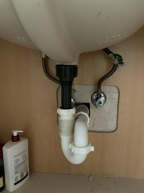 Responded to service call for clogged HVAC drain line after HVAC contractor was unable to clear the blockage. Inspected drain system and boiler room plumbing to identify source of clog, with suspected main line obstruction. Additionally assessed dripping faucet and leak at main bathroom sink basin where P-trap connection to drain assembly required adjustment beyond homeowner's attempted repair.
