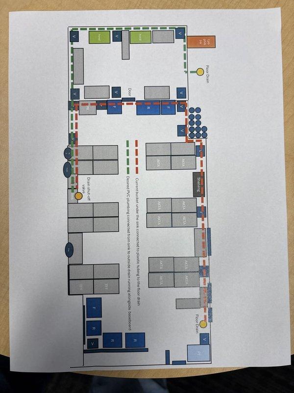 Conducted site assessment for commercial plumbing piping estimate involving chemical waste drainage system handling Sodium Hydroxide (0.1M) solutions with basic pH levels. Reviewed facility floor plans and layout diagrams to identify existing drainage infrastructure, piping routes, and equipment locations for proper chemical waste disposal compliance. Documentation included photographic records of architectural layouts showing multiple zones, drainage pathways, and potential connection points for alkaline waste management system.