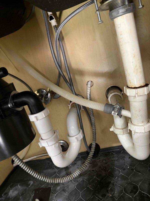 Successfully completed installation of new Moen Renzo CA87316SRS kitchen faucet in brushed stainless finish. Removed existing faucet assembly, installed new single-handle pull-down unit with proper mounting and secure connections to hot and cold water supply lines using braided stainless steel flex lines. Verified all connections for proper seal, tested water flow and temperature control, and ensured no leaks at supply line connections or mounting points.
