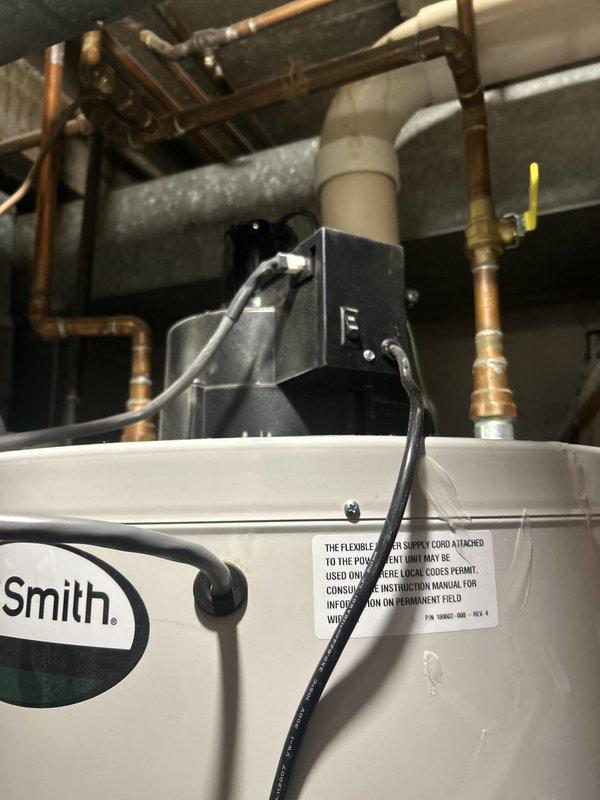 Performed comprehensive VIP maintenance on Smith brand tank-style water heater system. Conducted thorough inspection of unit, copper supply lines, gas connections with yellow-handled shutoff valve, and associated plumbing infrastructure. Verified proper operation of electrical connections, assessed condition of piping system including joints and fittings, and documented equipment status with photographic records for maintenance history.