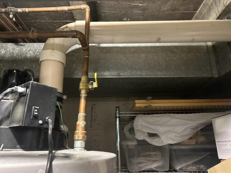 Performed comprehensive VIP maintenance on Smith brand tank-style water heater system. Conducted thorough inspection of unit, copper supply lines, gas connections with yellow-handled shutoff valve, and associated plumbing infrastructure. Verified proper operation of electrical connections, assessed condition of piping system including joints and fittings, and documented equipment status with photographic records for maintenance history.
