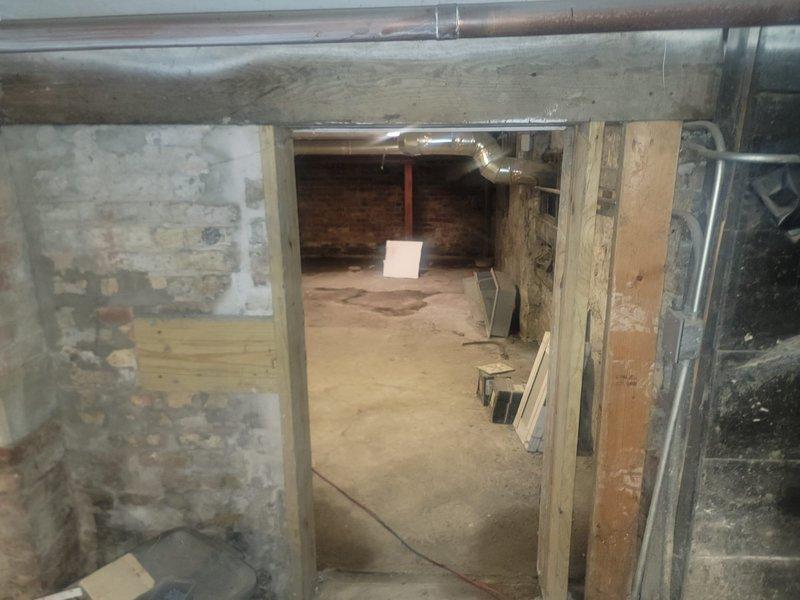 # Drain and Sewer Camera Inspection

Performed comprehensive video camera inspection of underground sewer and drain lines in basement area to assess pipe condition and identify potential cracks or structural damage. Accessed sewer system through existing cleanouts in unfinished basement with exposed brick walls and concrete flooring. Successfully completed full camera run through main line, documenting pipe integrity throughout entire accessible system. Inspection revealed no visible cracks, breaks, or structural defects in the sewer pipes. All lines showed normal wear consistent with age but remained fully functional with proper flow capacity. Provided customer with peace of mind regarding underground plumbing infrastructure condition. Work area included basement space undergoing renovation with exposed HVAC ductwork and utility systems.