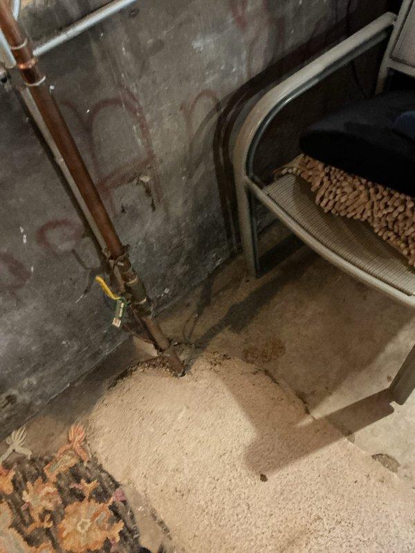 Responded to coach house residence for multiple plumbing concerns including leaky outdoor faucets, toilet issues, and kitchen sink drainage problems. Inspected and documented kitchen sink drain assembly beneath double-bowl sink, verifying PVC P-trap configuration and connections for periodic leak source. Assessed basement plumbing infrastructure, including copper supply lines with brass shutoff valves showing age-related deterioration and water staining on adjacent surfaces. Evaluated both outdoor hose bibs for replacement needs and verified operational status. Addressed two separate toilet malfunctions: one with active leak and second exhibiting intermittent water spurting during flush cycle. All plumbing systems inspected and photographed for comprehensive assessment of repair requirements.