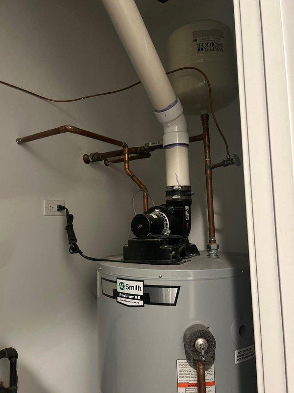 Responded to service warranty call for continuously running pump motor in 9-unit building following previous diagnostic visits. Conducted comprehensive inspection of AO Smith ProLine XE water heater system, including circulator pump assembly, expansion tank, and associated plumbing connections. Examined all copper piping, soldered joints, pressure relief valve, and PVC venting system for signs of leakage or system pressure loss. Verified proper operation of pump motor controls and electrical connections. Documented equipment condition with photographic evidence showing water heater installation, pump assembly, and mechanical room configuration to support ongoing investigation of suspected leak within building plumbing system.