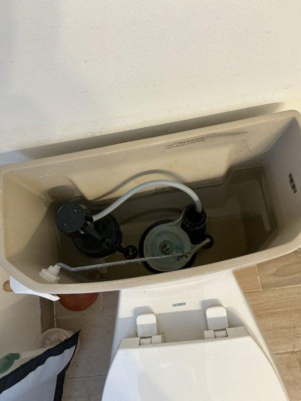 Responded to service call for toilet randomly running intermittently. Upon inspection, removed tank lid and diagnosed faulty flapper valve assembly causing inconsistent seal and allowing water to leak from tank into bowl, triggering fill valve to activate periodically. Replaced worn flapper valve and adjusted chain length to ensure proper seating and complete seal when flush cycle completes. Tested flush mechanism multiple times to verify proper operation and confirm intermittent running issue was resolved.