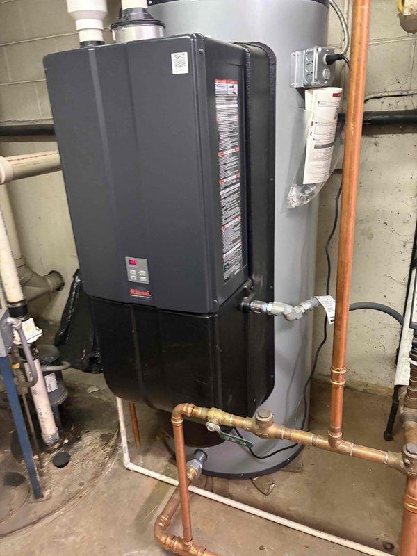 Conducted comprehensive assessment of existing water heating system in commercial building mechanical room. Evaluated current installation featuring aging insulated piping, multiple PVC drain lines, and conventional tank-type water heater alongside existing tankless unit. Documented equipment condition showing wear on pipe insulation, corroded fittings, and outdated components requiring replacement. Photographed existing copper supply lines, gas connections, venting systems, and electrical infrastructure to develop accurate replacement specifications. Provided detailed estimate for complete water heater replacement including removal of old equipment, installation of new unit with appropriate venting, updated copper piping connections, code-compliant gas line work, and proper condensate drainage system. Assessment included evaluation of mounting requirements, clearance specifications, and utility connections necessary for successful installation.