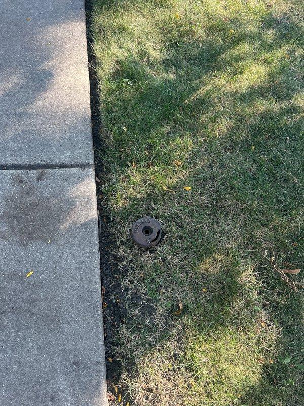 Responded to service call for sump pump battery backup system evaluation and replacement estimate. Performed on-site assessment of existing battery backup unit and measured discharge line routing from structure to lawn area. Documented current system configuration and exterior discharge point location for replacement specifications.