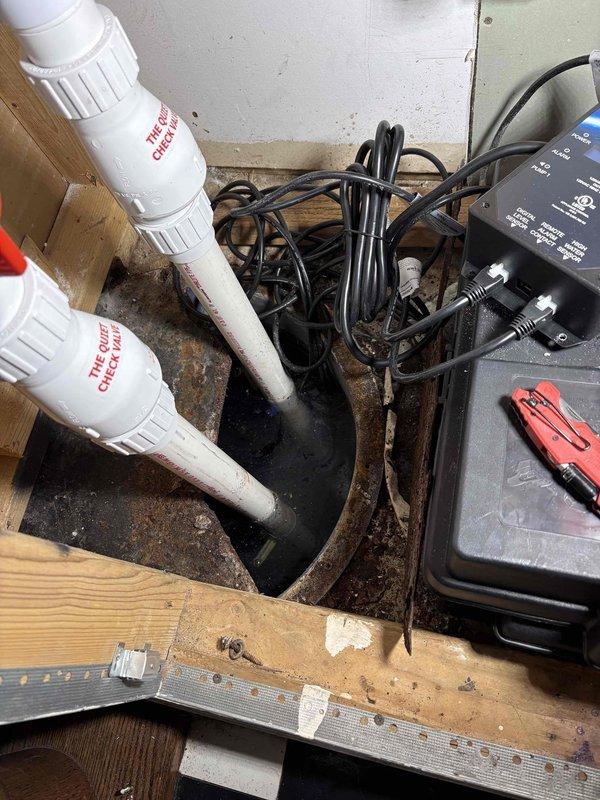 Responded to service call for non-functional ION control panel managing sump pump and ejector pump system. Upon inspection, determined that backup battery had failed, rendering the Take Control Ion Remote monitoring system inoperative. Assessed the dual-pump configuration with radon mitigation integration, noting the system included both sump and ejector pumps with dedicated control valves. Replaced failed battery and restored power to the ION control panel, verifying proper operation of display and monitoring functions. Tested communication between control unit and pump systems to ensure proper functionality. Confirmed both pumps responded appropriately to control signals and that all electrical connections were secure and properly terminated. System returned to full operational status with monitoring and control capabilities restored.