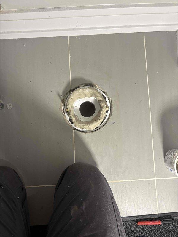 Responded to service call for wobbly toilet fixture. Upon inspection, found toilet flange showing signs of age and water exposure with potential compromise to mounting stability. Removed toilet to assess flange condition and floor mounting integrity. Verified flange hardware, addressed instability issue, and reinstalled toilet with proper sealing to prevent future leaks and ensure secure mounting.