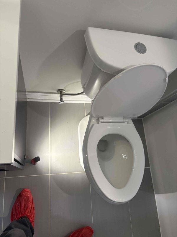 Responded to service call for wobbly toilet fixture. Upon inspection, found toilet flange showing signs of age and water exposure with potential compromise to mounting stability. Removed toilet to assess flange condition and floor mounting integrity. Verified flange hardware, addressed instability issue, and reinstalled toilet with proper sealing to prevent future leaks and ensure secure mounting.