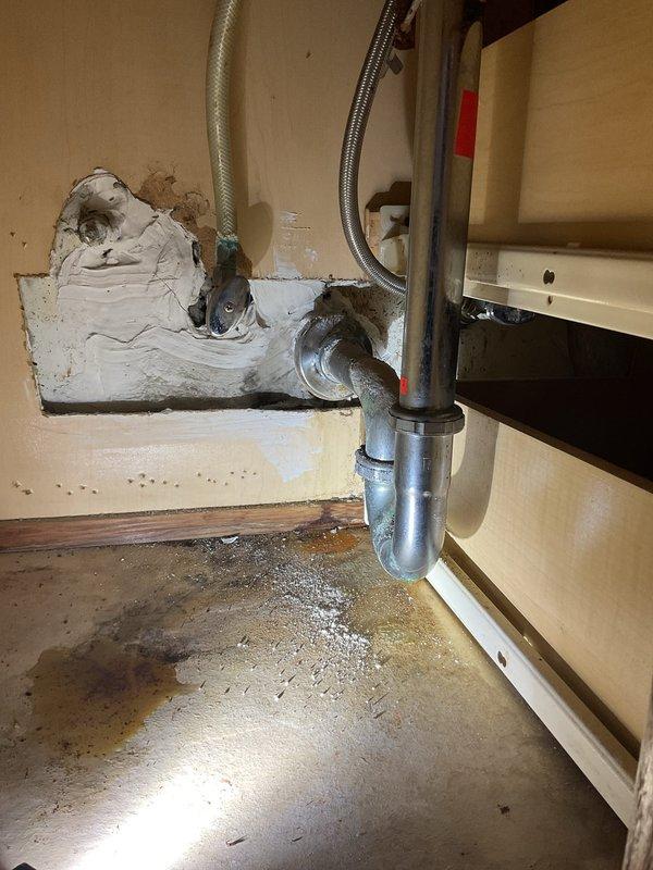 Responded to emergency service request for clogged bathroom sink and slow-draining tub in rental unit. Conducted initial assessment and documented existing plumbing conditions, including P-trap assembly, supply lines, and under-sink drainage system. Inspection revealed water damage and deterioration in cabinet area beneath sink, with visible staining on cabinet floor indicating previous moisture issues. Scheduled service appointment and added customer to priority move-up list for earlier availability if possible.