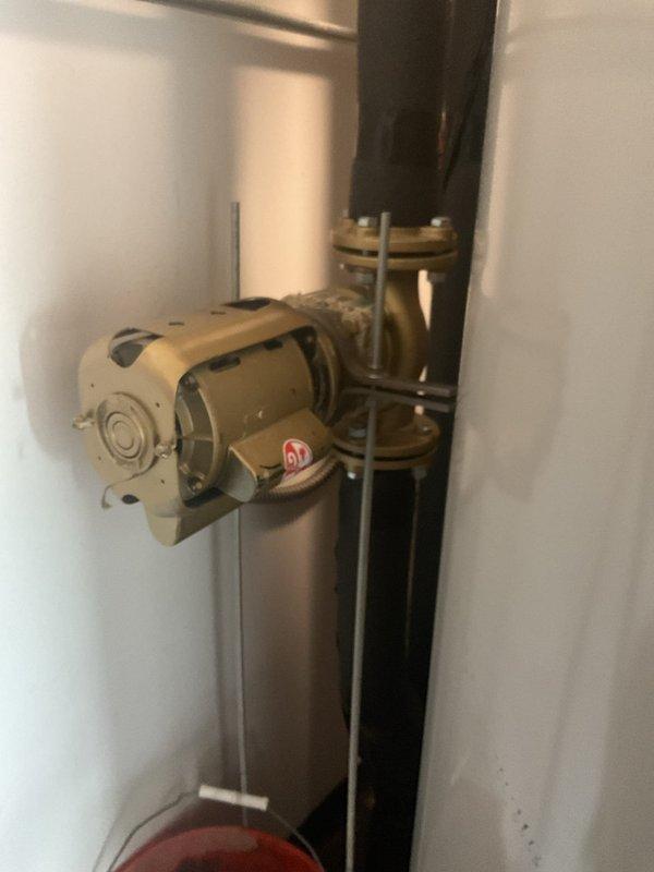 Responded to service call for leaking expansion tank on water heater system. Upon inspection, confirmed active leak at expansion tank connection point. Documented existing equipment configuration including pump assembly, motor components, and associated piping. Provided estimate for expansion tank replacement including removal of failed unit, installation of new properly-sized expansion tank, pressure testing of system, and verification of proper operation upon completion.