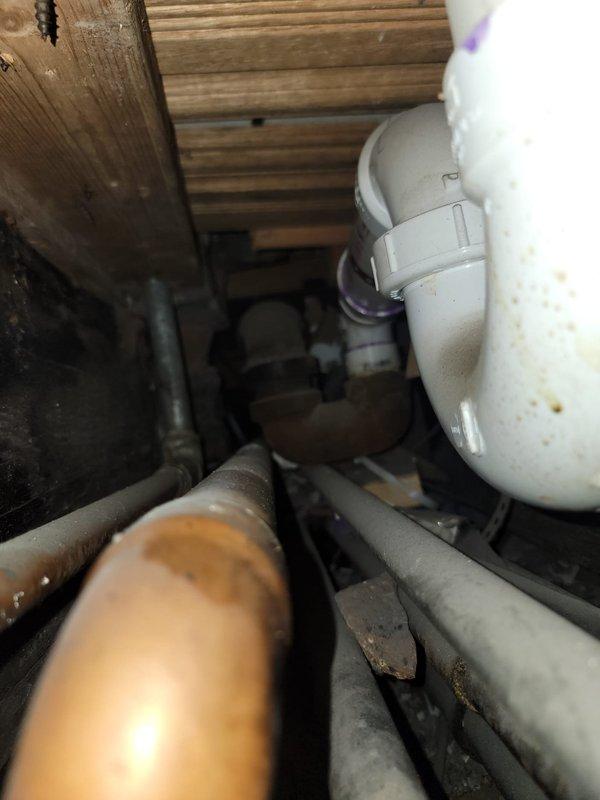 Responded to return service call for recurring shower drain backup that had been temporarily cleared during previous visit. Performed thorough inspection of drainage system including crawl space access to assess underlying plumbing infrastructure and identify root cause of persistent clogging. Examined PVC drainage lines, connections, and pipe routing beneath floor joists to determine if blockage was localized or symptomatic of larger drainage system issues requiring more extensive repair work beyond basic snaking procedures.
