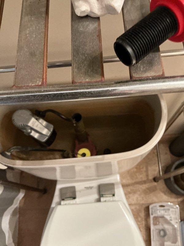 Responded to service call for continuously running toilet with malfunctioning shut-off valve. Upon inspection, found the angle stop valve had failed and was unable to properly control water flow to the toilet tank. Removed toilet tank lid and assessed internal components, noting sediment buildup and worn flush valve assembly. Replaced defective angle stop valve with new fixture to restore proper water shut-off functionality. Tested new valve operation and verified complete water flow control. Inspected tank mechanisms and confirmed proper operation of fill valve and flush assembly following repair.