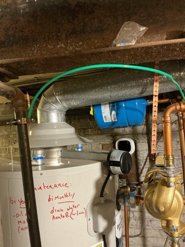 Completed installation of 8-inch flue pipe section for water heater system and applied hydraulic cement as needed to ensure proper sealing and code compliance. All components were inspected and verified operational, with existing plumbing and HVAC systems remaining fully functional throughout the installation process.