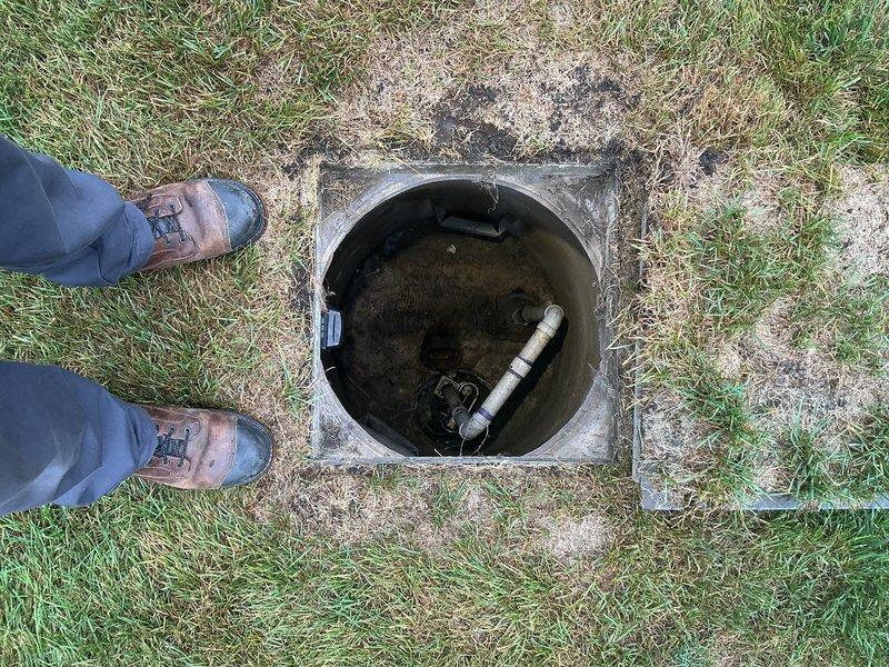 Conducted on-site assessment for flood control system installation. Inspected existing sump pump configuration in basement pit, documenting current submersible pump setup with PVC discharge piping and evaluating pit condition. Examined exterior discharge point and termination location in yard, verifying proper drainage pathway and identifying system components. Provided comprehensive estimate for complete flood control solution based on property conditions and customer requirements.