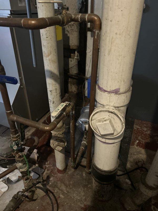 Responded to a leaking pipe emergency in the basement unit located beneath the kitchen sink area. Upon accessing the mechanical space through the main unit, identified a compromised copper water supply line showing active deterioration and leakage. Performed a complete pipe replacement of the affected section, installing new copper piping with proper fittings and connections to restore water service. Verified all joints for proper seal integrity and tested the system under full pressure to confirm the leak was eliminated and water flow was restored to normal operation.