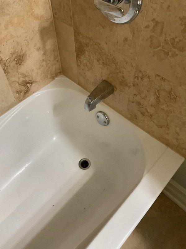 Responded to slow draining bathtub complaint and performed drain clearing service. Removed accumulated hair and fibrous debris causing blockage in bathtub drain line. Verified proper drainage flow restored upon completion of cleaning procedure.