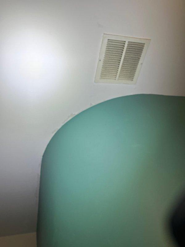 Responded to active water leak in unoccupied rental unit. Upon arrival, conducted thorough inspection of water heater and surrounding utility area as reported by property owner. Examined gas water heater installation, including tank condition, control valve assembly, supply lines, and drain pan area. Inspected ceiling and walls in adjacent spaces for signs of water intrusion, noting visible moisture indicators at ceiling vent location. Documented all findings with photographic evidence showing water heater installation and affected ceiling areas. Identified source of leak and provided property owner with assessment of necessary repairs and recommendations for resolution.