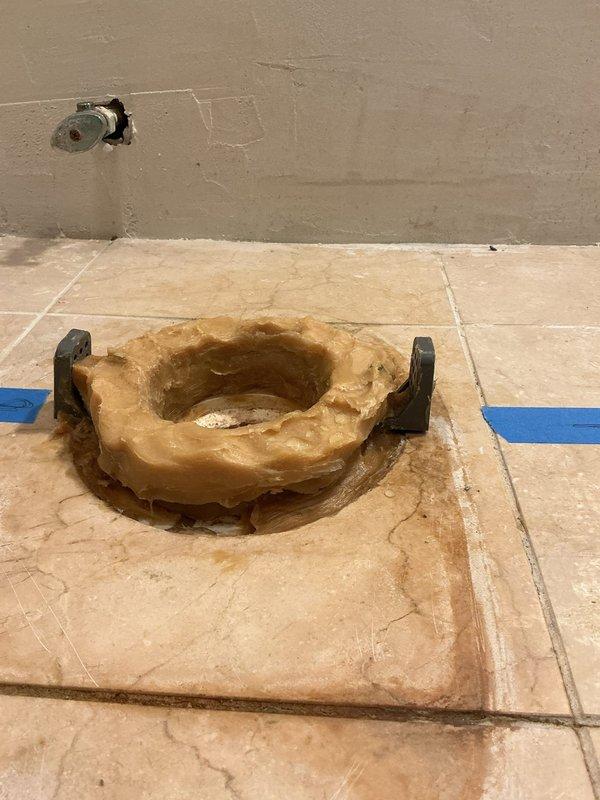 Completed toilet replacement in residential bathroom. Removed existing two-piece toilet, inspected floor flange and wax ring, and installed new toilet unit. Verified proper sealing at base, confirmed water supply line connection was secure, and tested for leaks. Existing angle stop did not require replacement as confirmed during pre-installation assessment.