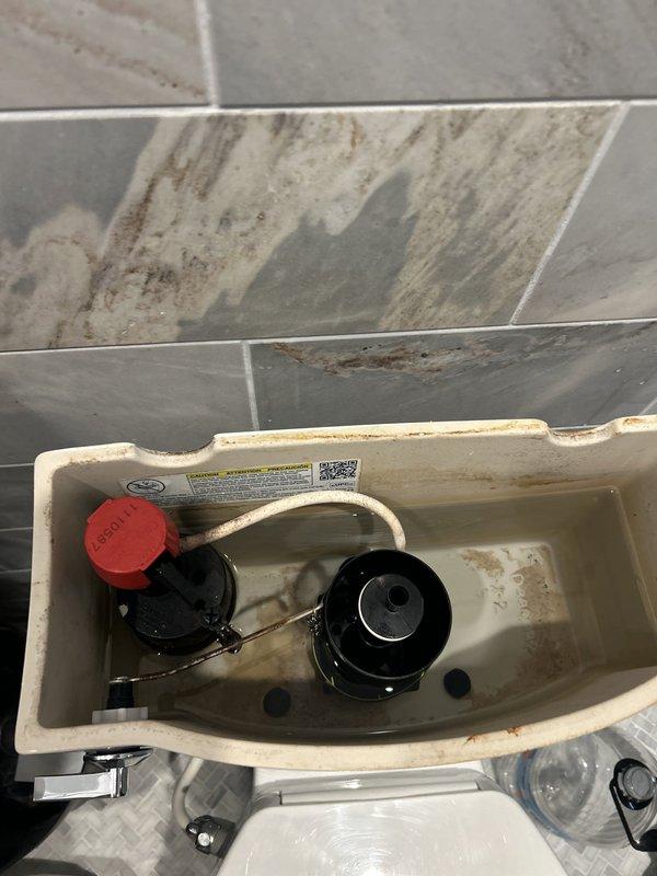 Responded to service call for multiple toilets continuously running following recent municipal water line replacement work. Upon inspection, identified that increased water pressure from new street infrastructure was causing fill valves to malfunction and overflow into toilet tanks. Examined flush mechanisms and fill valve assemblies in affected fixtures, noting mineral deposits and age-related wear that compounded pressure regulation issues. Adjusted fill valve float heights and water levels in toilet tanks to accommodate higher incoming water pressure. Verified proper shutoff function of fill valves and confirmed toilets ceased continuous running after adjustments were completed.
