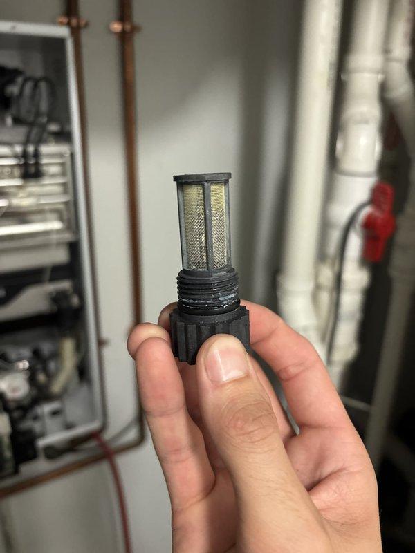 Performed routine maintenance on tankless water heater system, including cleaning of the inlet filter screen which showed sediment accumulation. Inspected and serviced the condensate drain system to ensure proper drainage and prevent potential blockages. All components were examined for proper operation and the unit was returned to normal service.