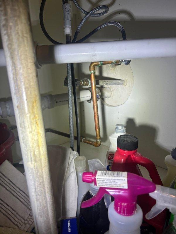 # Plumbing Install - Piping

Returned to property to complete rough-in plumbing installation following cabinet and sink installation. Successfully connected drain line and water supply lines to new sink fixture, including hot and cold water supply hookups with braided flexible supply hoses and proper shut-off valve installation. All connections tested and verified leak-free upon completion.