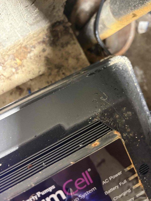 Responded to service call for sump pump alarm that was continuously sounding. Upon arrival, inspected the sump pump control system and located the alarm panel with digital display showing system status including AC power, battery, and charging indicators. Assessed the red-handled isolation valve and associated piping to ensure proper operation. Successfully silenced the alarm and verified system functionality, confirming the pump control panel was receiving power and battery backup was fully charged.