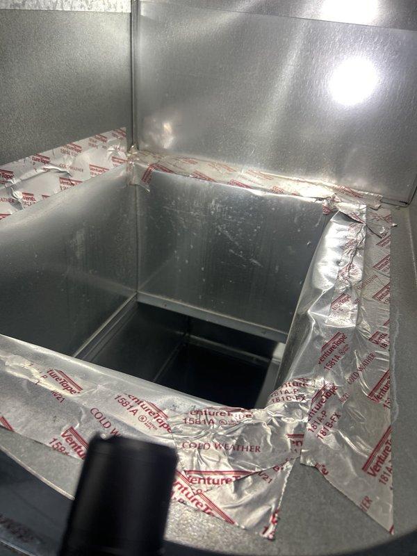 Responded to emergency water leak through ceiling with unknown source. Upon inspection of utility area and plumbing infrastructure, examined water heater, associated piping systems, and HVAC ductwork to identify leak origin. Investigated complex network of PVC, copper, and brass piping connections, valves, and fittings throughout mechanical space. Inspected HVAC air handler system and ductwork with insulation for signs of moisture intrusion or condensate issues. Documented conditions with photographic evidence showing plumbing equipment, pipe configurations, and interior ductwork access points for further diagnostic evaluation and repair planning.