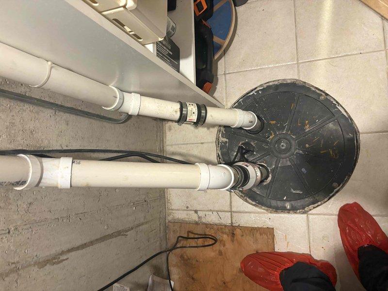 Conducted inspection of existing sump pump and ejector pump system to assess condition and determine replacement needs. Evaluated current equipment age, operational status, and performance capabilities. Documented existing installation configuration including PVC discharge piping and electrical connections. Provided comprehensive estimate for new sump pump or ejector system replacement, battery backup installation options, and exterior drain cleaning services.