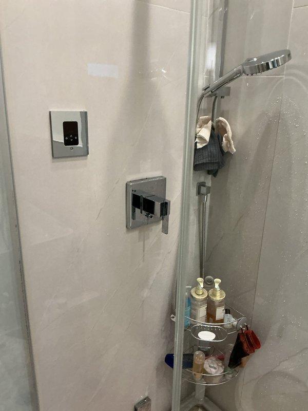 Responded to service call for reported shower leak behind trim with suspected cartridge failure. Removed existing shower valve trim and accessed mixing valve assembly. Confirmed cartridge was source of leak based on visible water intrusion and wear patterns. Installed customer-provided replacement cartridge, ensuring proper alignment of hot and cold water indicators. Replaced all seals and O-rings included with new cartridge assembly. Reassembled trim components and tested valve operation through full range of motion. Verified complete water shutoff and proper mixing function at various temperature settings. Inspected for leaks behind trim during testing with no moisture detected. System restored to full operation with no active leaks present.
