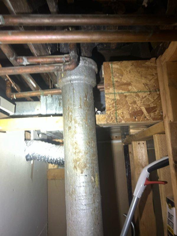 Returned to property for callback to assess and provide quote for loop vent installation. Documented existing under-sink plumbing configuration including PVC drainage system and water filtration setup, as well as basement mechanical area showing copper supply lines and HVAC ductwork where loop vent would be integrated.