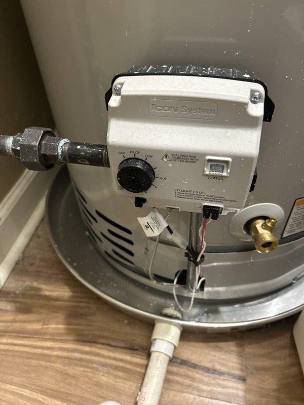 Responded to warranty call for recently installed tanked water heater with customer reporting no hot water delivery to shower fixtures. Upon inspection, verified water heater installation integrity including gas control valve operation, burner assembly function, and all supply connections. Examined multi-valve shower system with thermostatic controls, body sprays, and handheld fixtures to diagnose delivery issue between water heater and end-use points. Documented equipment conditions and system configuration through photography for warranty documentation purposes.
