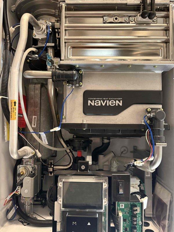 Completed annual maintenance service on Navien tankless water heater system under existing service contract. Performed comprehensive system flush to remove mineral buildup and sediment accumulation from heat exchanger and internal components. Inspected all plumbing connections, copper and brass piping, valves, and flexible hoses for signs of wear or leakage. Verified proper operation of pressure relief valve, circulation system components, and water filtration housing with media cartridge. Tested digital control interface functionality and reviewed system diagnostics through onboard LCD display. Confirmed all pressure gauges reading within normal operating parameters. System operating efficiently with no issues detected upon completion of service.