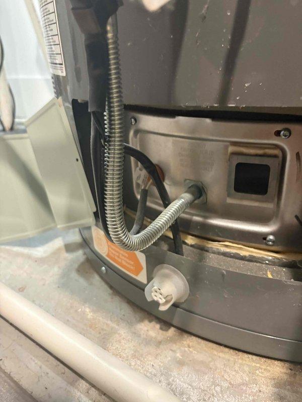 Picked up flame verification sensor from Addison Street location for HVAC unit servicing. Documented existing water heater installation and associated plumbing connections, including copper and PVC piping configurations with flow meter. Replacement of flame verification sensor scheduled for following day to restore proper furnace operation and safety controls.
