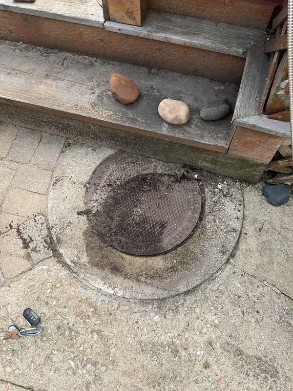 Responded to a sewer rodding service call and successfully cleared the main drain line through the exterior cleanout access point located in the concrete patio area. Upon arrival, removed the metal cleanout cover, deployed the cable rodding equipment through the access point, and thoroughly cleared any blockages or buildup in the mainline to restore proper drainage flow.