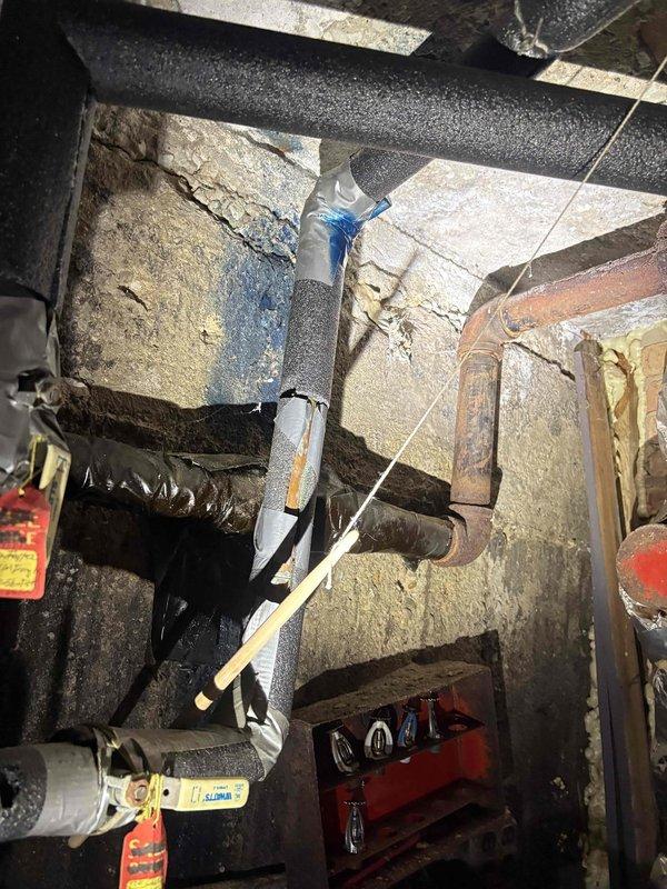 Completed commercial plumbing piping corrections in crawl space and exterior service area, including installation and routing of copper and PVC lines with proper insulation and support. Addressed code compliance issues and secured all pipe runs per commercial specifications, with work verified through documentation photography.