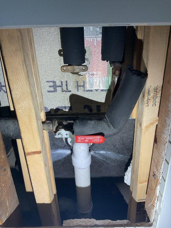Responded to water leak investigation between first and second floors of condo building where source could not be initially traced. Accessed ceiling space and inspected plumbing infrastructure, including PVC supply lines with shut-off valves passing through floor joists. Examined tiled bathroom area including wall and floor surfaces for signs of moisture intrusion or compromised grout and sealant. Documented findings with photos of accessible plumbing components and potentially affected areas for further evaluation and repair planning.