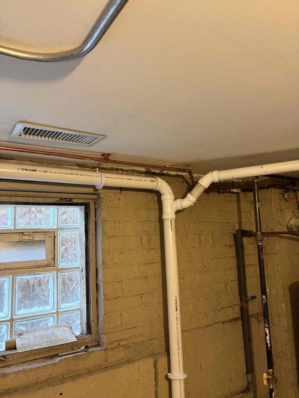 Completed comprehensive VIP plumbing maintenance inspection of residential property. Performed thorough evaluation of all accessible plumbing systems including main water supply lines, copper piping network, shut-off valves, and PVC drainage systems throughout basement utility areas. Inspected pipe joints, fittings, and connections for signs of corrosion, leaks, or deterioration. Verified proper operation of brass valves and examined pipe mounting brackets for secure installation. Documented current condition of plumbing infrastructure with photographic records showing copper supply lines with normal patina development and PVC drainage system in satisfactory working condition. All systems found to be functioning within normal parameters with no immediate repairs required at time of inspection.