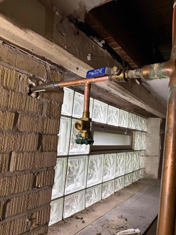 Completed comprehensive VIP plumbing maintenance inspection of residential property. Performed thorough evaluation of all accessible plumbing systems including main water supply lines, copper piping network, shut-off valves, and PVC drainage systems throughout basement utility areas. Inspected pipe joints, fittings, and connections for signs of corrosion, leaks, or deterioration. Verified proper operation of brass valves and examined pipe mounting brackets for secure installation. Documented current condition of plumbing infrastructure with photographic records showing copper supply lines with normal patina development and PVC drainage system in satisfactory working condition. All systems found to be functioning within normal parameters with no immediate repairs required at time of inspection.