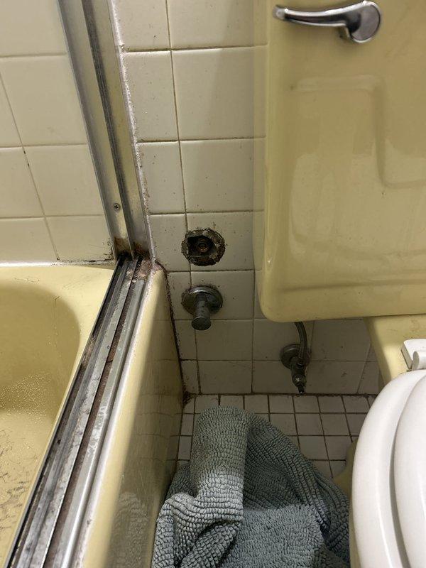 Responded to emergency service call for non-functional shower tub diverter preventing shower use. Upon inspection, found the pull-up diverter tab on the tub spout was inoperable, leaving only bathtub function available. Assessed the chrome tub spout assembly and diverter mechanism for mechanical failure. Replaced the defective tub spout diverter assembly with new chrome fixture, restoring proper water flow diversion between tub faucet and handheld showerhead. Tested operation multiple times to ensure smooth transition between tub and shower modes with no leaks or water pressure issues. Shower fully restored to working condition.