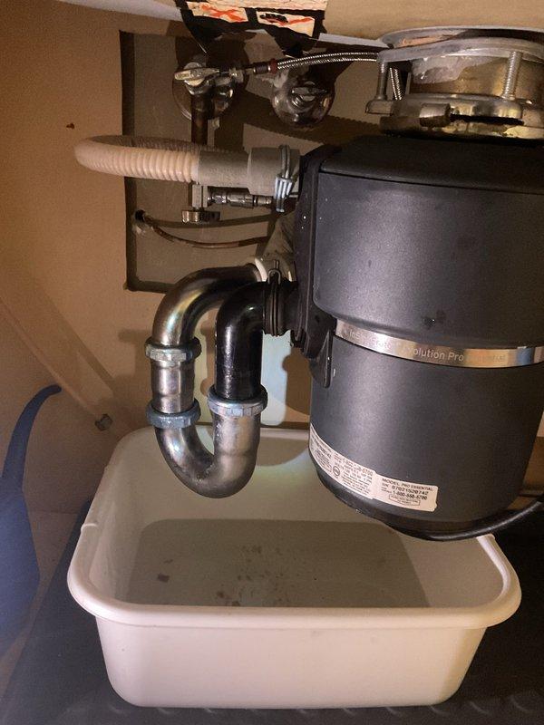 Replaced existing metal drain piping from garbage disposal with PVC piping to match the PVC line coming from the wall. Addressed water purifier that had been previously removed by customer, assessing options for removal or repositioning of the unit and associated plumbing connections.