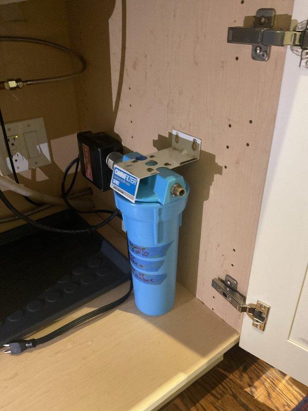 Replaced existing metal drain piping from garbage disposal with PVC piping to match the PVC line coming from the wall. Addressed water purifier that had been previously removed by customer, assessing options for removal or repositioning of the unit and associated plumbing connections.