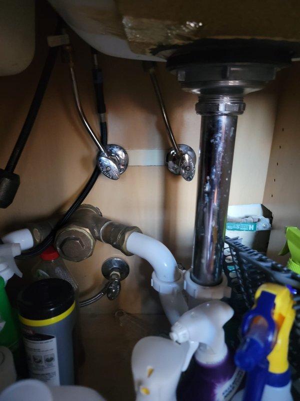 Responded to report of slow leak from dishwasher supply line. Upon inspection of under-sink plumbing, identified moisture at connection point between braided stainless steel supply line and dishwasher inlet valve. Tightened compression fitting at supply line connection and verified all associated plumbing connections for proper seal. Inspected drain assembly and P-trap configuration for any additional leak sources. Tested system by running dishwasher through fill cycle and monitored all connections for leaks. Confirmed repair successful with no active leaking present at completion.