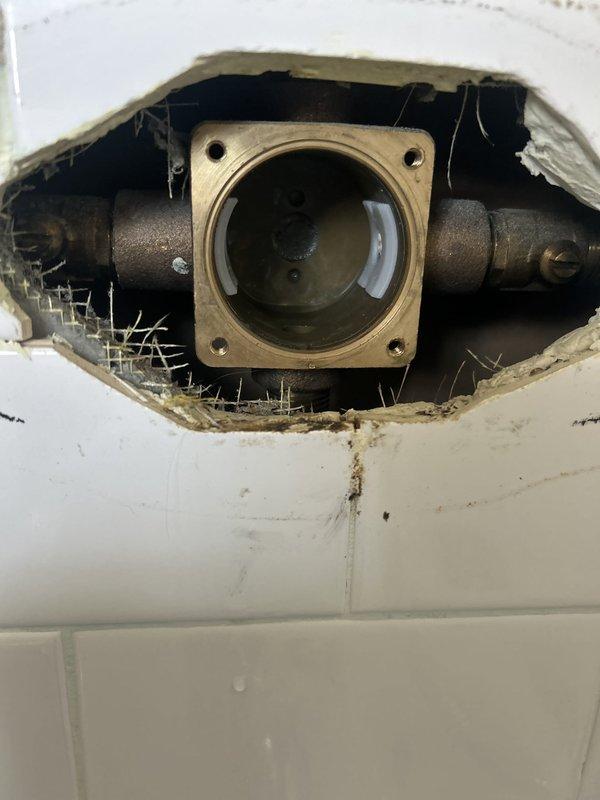 Responded to warranty callback for recent water heater installation. Upon arrival, inspected exhaust venting system and confirmed exhaust pipe was making contact with HVAC return duct. Adjusted and repositioned exhaust piping to eliminate interference with air conditioning return, ensuring proper clearance and code compliance. Addressed accessibility concern regarding shut-off valve that was obstructed by installation components. Repositioned valve assembly and verified full operational access for future maintenance requirements. Documented final configuration with photographs showing corrected valve placement and clearance specifications. All components tested and verified functioning properly with adequate clearances maintained throughout installation.