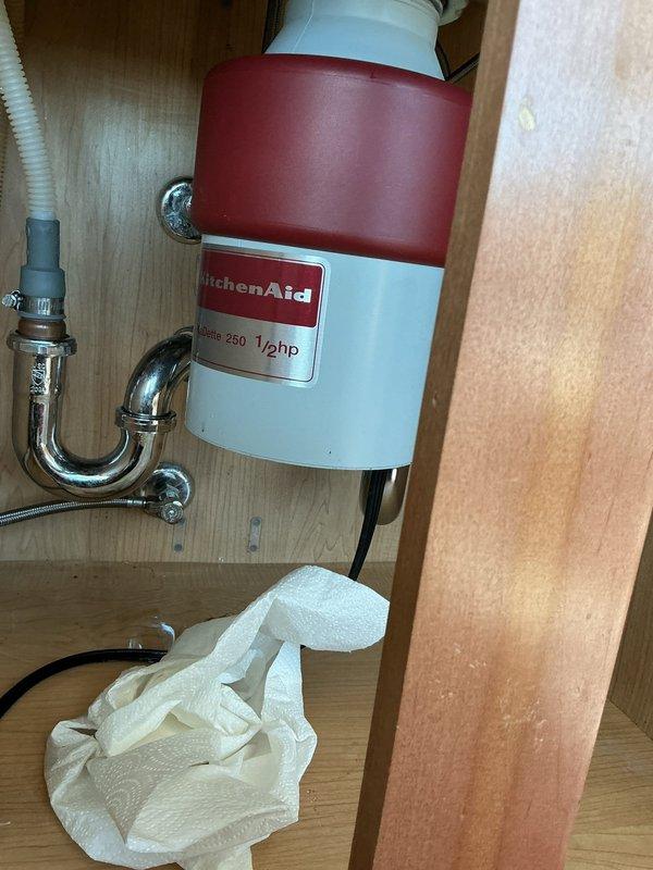 Installed new KitchenAid Continuous Feed 1/2 HP garbage disposal unit under kitchen sink. Connected unit to existing plumbing system with chrome P-trap and drain assembly, ensuring proper mounting and secure electrical connection. Provided customer with manufacturer's guidelines on proper disposal usage, including acceptable items such as food scraps, fruit and vegetable waste, and small bones, while advising against disposal of oils, grease, and non-food materials to ensure optimal performance and longevity of the unit.