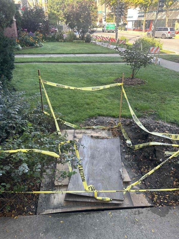 Responded to residential property for drain and sewer system evaluation. Upon arrival, observed recent concrete pathway repair work with caution tape perimeter indicating active curing process in landscaped front yard area. Conducted thorough inspection of underground plumbing infrastructure, which revealed severely corroded cast iron pipe fitting requiring replacement. Excavated and exposed deteriorated piping component showing extensive rust damage and structural compromise from prolonged moisture exposure and age-related degradation. Documented existing conditions through photographic evidence of both surface-level concrete work and subsurface plumbing failures. Assessed scope of necessary repairs including removal of compromised piping sections and installation of updated drain and sewer line components. Prepared comprehensive estimate for complete pipe replacement, excavation requirements, and restoration of affected landscape and hardscape areas following completion of undergroun